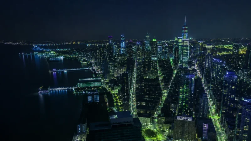 Aerial night view of a glowing city grid, for New York PPC market demands